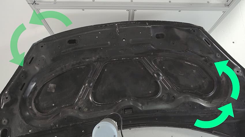 Car hood inspection using robotic AI vision Robotic arm using AI vision to inspect a car hood for surface scratches and dents