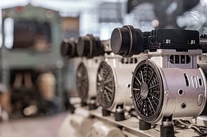 close up of an air compressor machine inside a factory