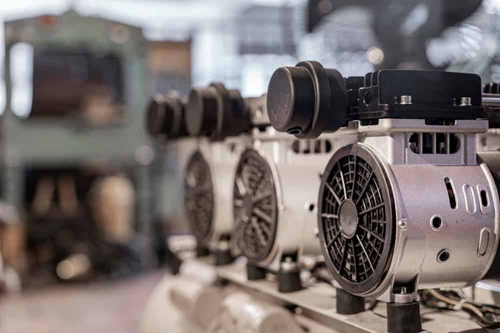 close up of an air compressor machine inside a factory