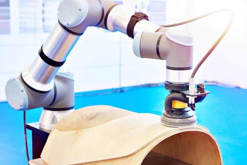 UR cobot performing automated grinding and sanding on a curved component to ensure high-quality surface finishing using SolMotion robotic AI vision.
