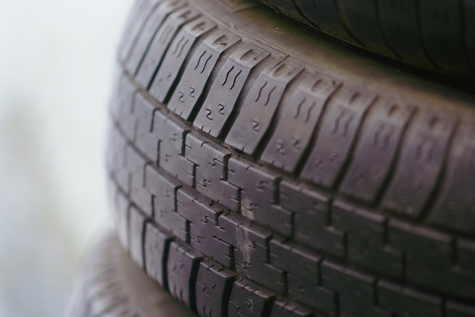 black rubber tire stack on a white background