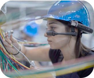 Get Started with Industrial Machine Vision Frontline worker wearing AR glasses inspecting industrial cables in a smart factory using machine vision.