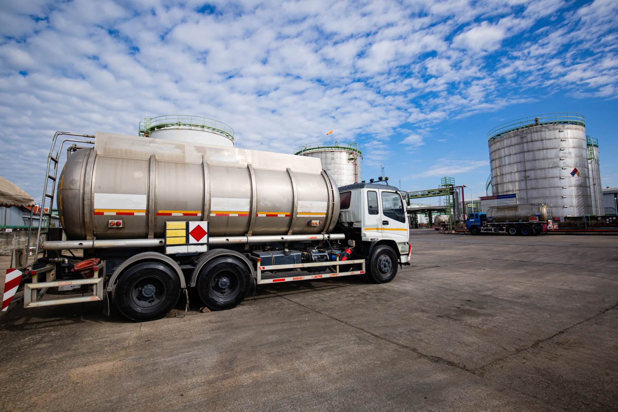 Chemical tanker truck unloading chemical tanker truck parked in a chemical plant